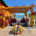 A lakeside patio beautifully enhanced by the Outdoor Living Today Western Red Cedar Pergola & Canopy with comfortable seating beneath