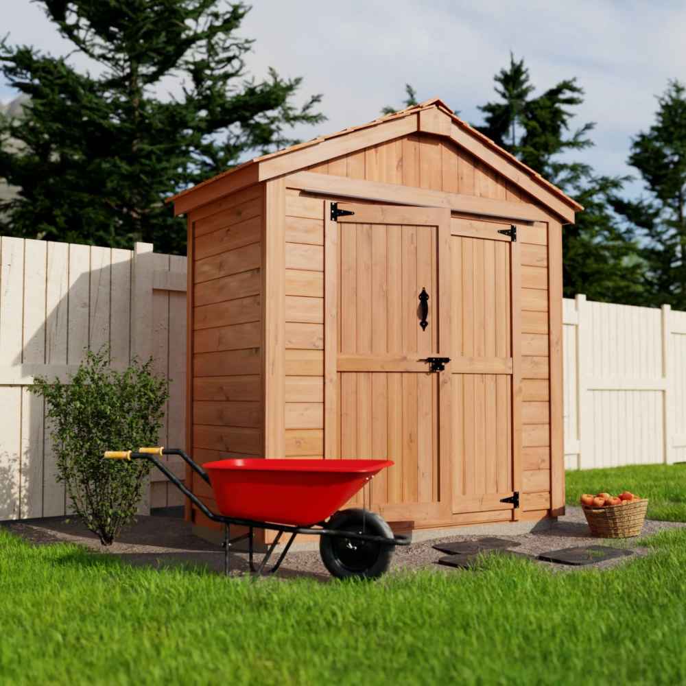 A left-angled view of the Outdoor Living Today SpaceMaster 6×4 with Double Door displays the shed’s side paneling and open yard space beside it, with a red wheelbarrow in front