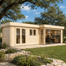 L-shaped light wood cabin with glass doors and large windows on a stone patio, surrounded by grass and trees.