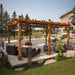 A luxurious backyard retreat showcasing the Outdoor Living Today Western Red Cedar Pergola & Canopy, elegantly complementing the outdoor furniture and landscape