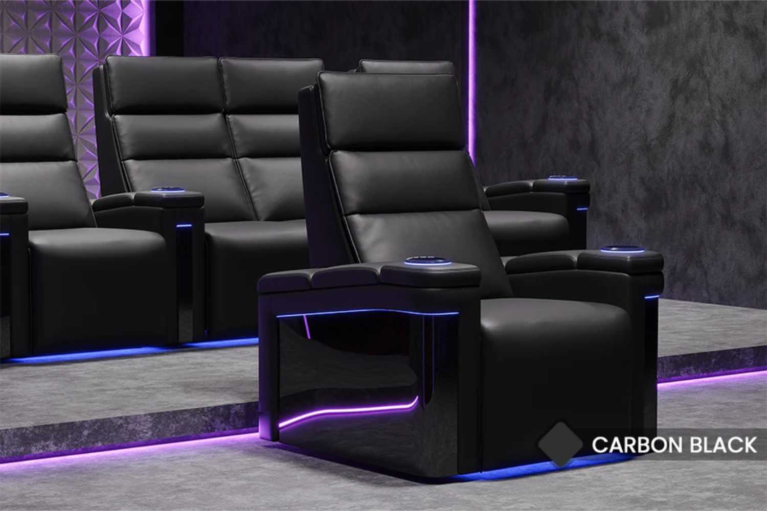 A luxurious black theater seat with glowing accents showcases the sleek design of the Valencia Monza Pillow Top Carbon Fiber Home Theater Seating