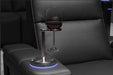 A metal wine glass holder accessory elegantly fits into the Valencia Monza Pillow Top Carbon Fiber Home Theater Seating