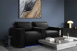 A modern living room setup features sleek Valencia Barcelona Home Theater Seating in luxurious black leather