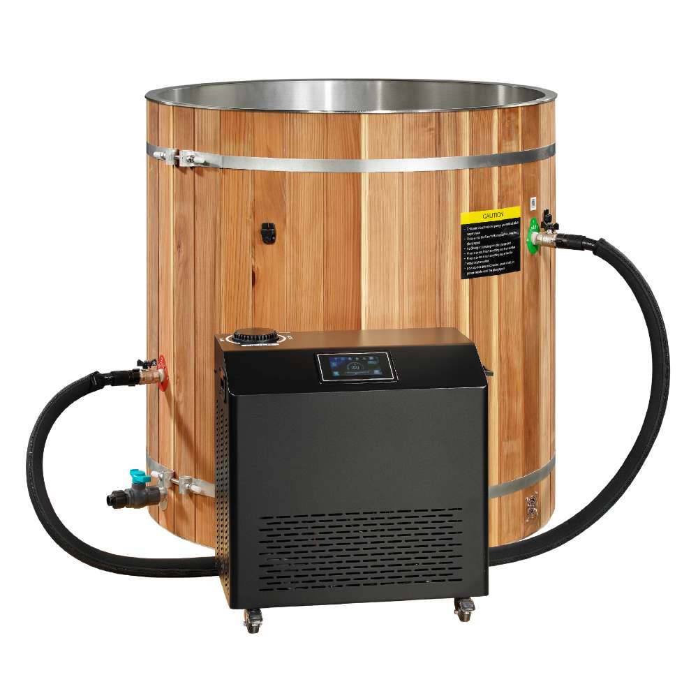An upright black chiller with a digital display panel connects by black hoses to Golden Designs Dynamic Cold Therapy Barrel 304 Stainless Steel Cold Plunge