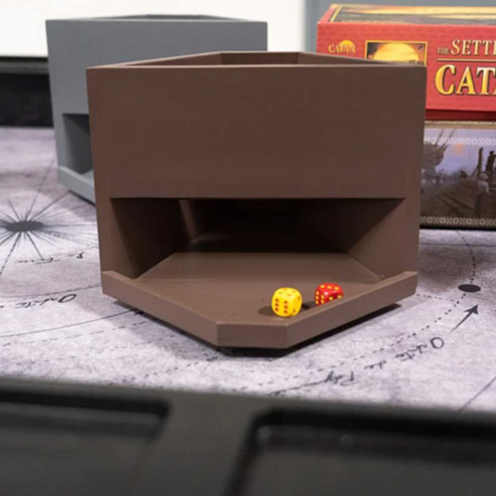 An American Walnut Game Theory Tables Dice Tower sits beside game pieces