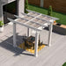 An aerial view captures the Structureworks Marquis Fiberglass Pergola centered over a table and chairs on a yellow outdoor rug