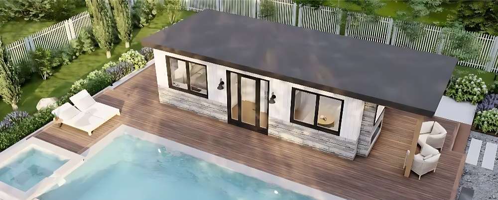 An aerial view of Sawmill Structures The Tremblant Garden Suites reveals its rectangular shape, sleek dark roof, and spacious deck