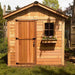 A natural wood garden shed with a window flower box and a locked door, representing the Outdoor Living Today 8×8 Gardener Shed