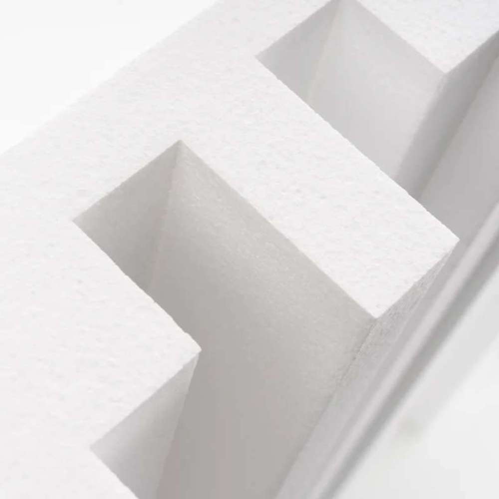 Angled close-up of the geometric cavities in a GIK Acoustics GridFusor™ Diffuser, designed to break up and spread sound evenly