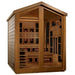 Angled from the left, Golden Designs Kaskinen 6 Person Barn Hybrid Outdoor Sauna shows its cedar side wall, peaked roof and red-glowing infrared panels inside
