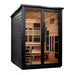 Angled from the left, Golden Designs Kaskinen 6 Person Black Barn Hybrid Outdoor Sauna shows its black slatted side wall, sloped roof and glass doors