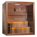 Angled from the left, Golden Designs Kuusamo 6 Person Traditional Sauna shows its cedar side wall, glass front and warm light glowing under the benches