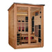 Angled from the left, Golden Designs Loviisa 3 Person Pacific Cedar Barn Hybrid Outdoor Sauna shows its cedar side wall, dark roof edge and glass doors