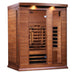 Angled from the left, Golden Designs Maxxus 3 Person Full Spectrum Infrared Sauna in Red Cedar shows its red cedar side wall, bronze glass door and glowing heaters
