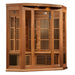 Angled from the left, Golden Designs Maxxus 3 Person Low EMF Far Infrared Corner Sauna in Red Cedar shows its red cedar corner walls, glass door and lower heaters
