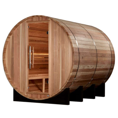 Angled from the side, Golden Designs Klosters 6 Person Barrel Traditional Sauna shows its curved cedar staves, glass door and benches inside