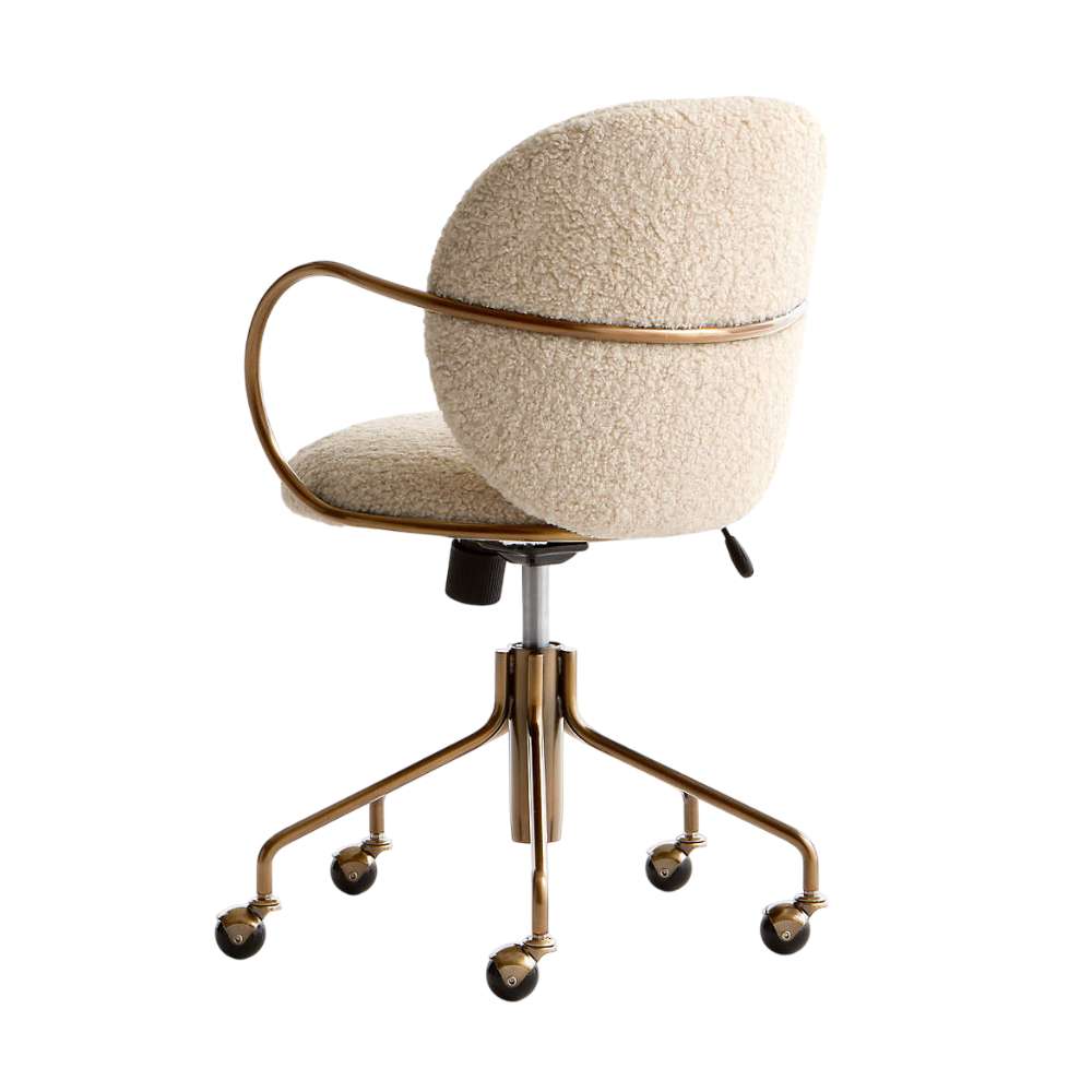 Angled front view of Crate & Barrel Luna Ivory Boucle Upholstered Office Chair with plush cushioning and rolling base