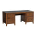 Angled front view of Crate & Barrel Morris 72" Chocolate Brown Writing Desk featuring four drawers, a black writing surface, and sturdy wood construction