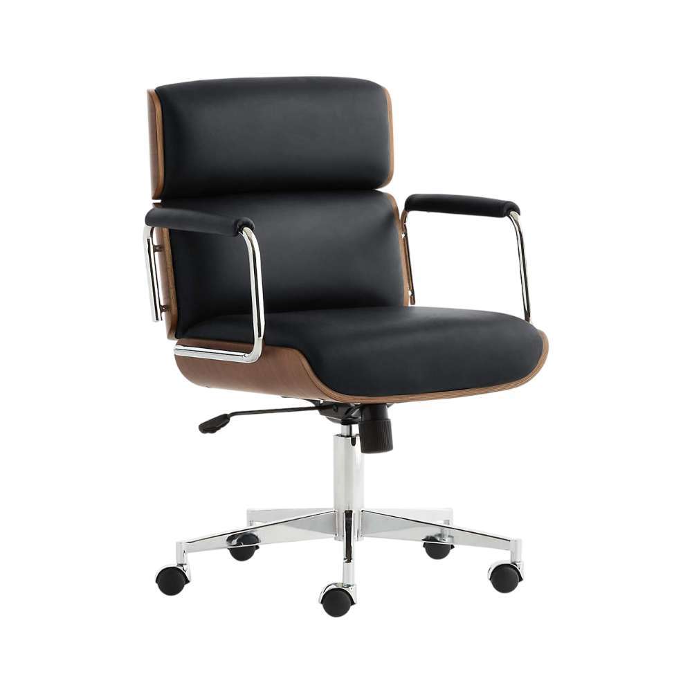 Angled front view of Crate & Barrel Palmer Upholstered and Wood Paneled Office Chair featuring black leather cushions, chrome armrests, and a swivel base