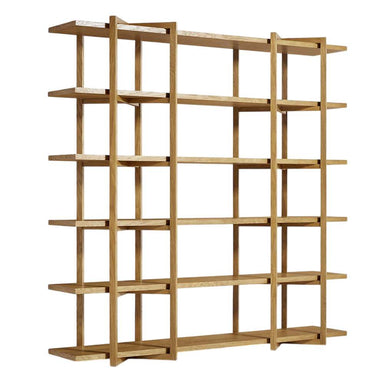 Angled front view of Crate & Barrel Thomas Barley Oak Wood Wide Open Bookcase/Room Divider displaying its wide open shelving and natural barley oak finish