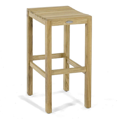 Angled view highlights the smooth teak wood grain and clean lines of Westminster Teak Somerset Backless Bar Stool against a plain white background