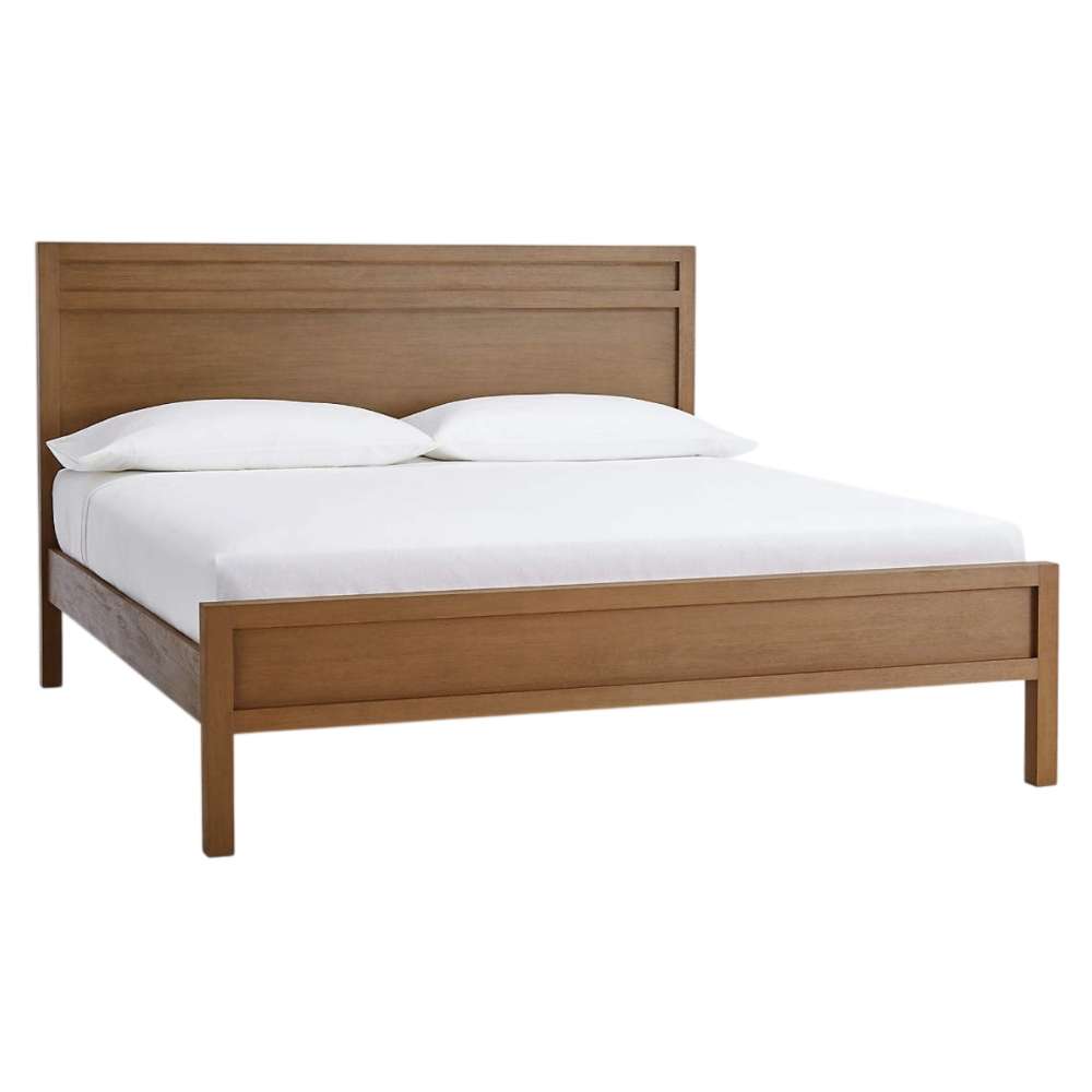 Angled view of Crate & Barrel Keane Solid Driftwood King Bed displaying the solid wood frame with a minimalist, modern design