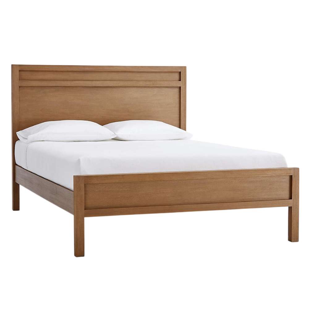 Angled view of Crate & Barrel Keane Solid Driftwood Queen Bed with a tall headboard, solid wood frame, and white bedding