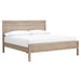 Angled view of Crate & Barrel Keane Weathered Natural Solid Wood King Bed displaying its minimalist solid wood frame with a weathered natural finish