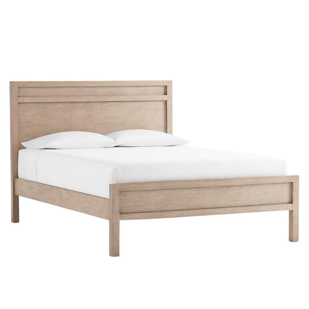 Angled view of Crate & Barrel Keane Weathered Natural Solid Wood Queen Bed with a light wood frame and crisp white bedding