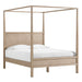 Angled view of Crate & Barrel Keane Weathered Natural Solid Wood Queen Canopy Bed showcasing its open canopy frame and solid wood construction