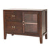 Angled view of Crate & Barrel Morris Chocolate Brown Credenza highlighting its wood grain, glass door, and brass-tone hardware