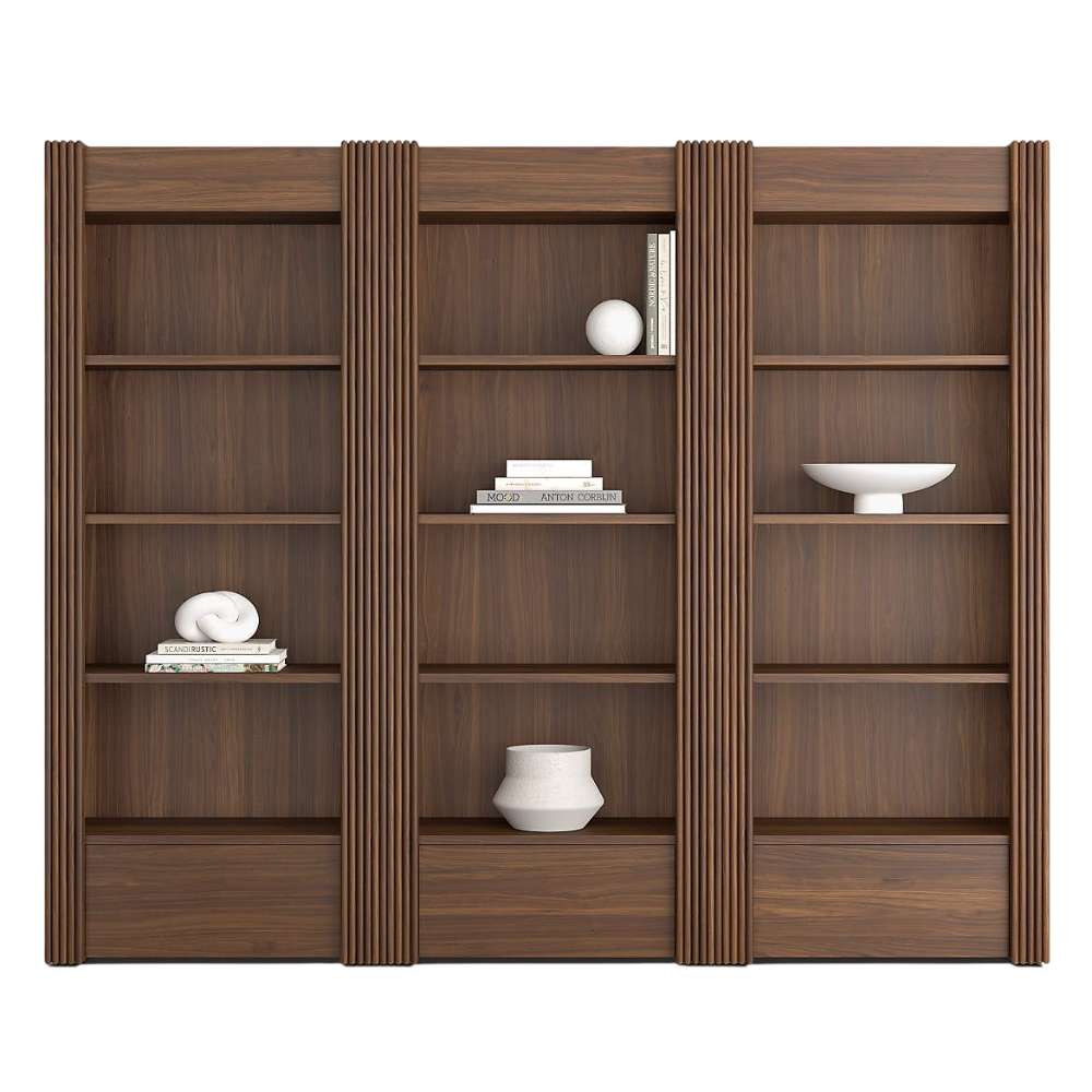 Angled view of Crate & Barrel Siena 102" Walnut Wood 4-Shelf Storage Bookcase with Drawer, Set of 3 with four open shelves each and built-in storage drawers at the base