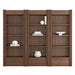 Angled view of Crate & Barrel Siena 102" Walnut Wood 4-Shelf Storage Bookcase with Drawer, Set of 3 with four open shelves each and built-in storage drawers at the base