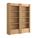 Angled view of Crate & Barrel Siena 68" Natural Wood 4-Shelf Storage Bookcase with Drawer, Set of 2 showcasing natural wood grain and fluted side details