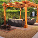 An image of the Outdoor Living Today Western Red Cedar Pergola & Canopy in a garden, showcasing outdoor wicker furniture beneath it