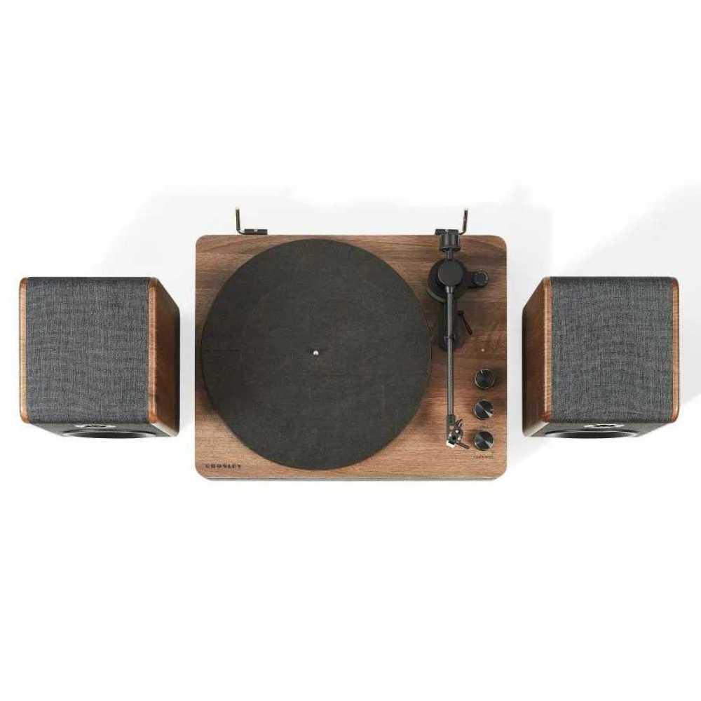 Another top view of the Crosley Nocturne Record Player With Speakers - Charcoal emphasizes the platter, tonearm, and control knobs with the lid open