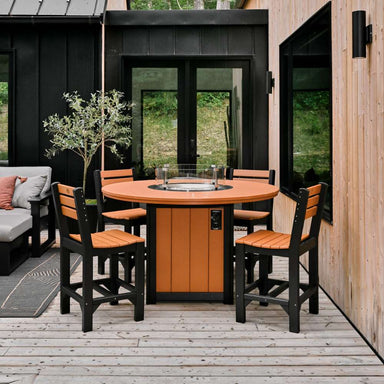 An outdoor setup with the LuxCraft Lumin Fire Table 60 Round Furniture Set, showing four matching cedar and black chairs around the fire table on a wooden deck