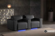 A pair of Valencia Barcelona Grand Ultimate Edition Home Theater Seating units stand side-by-side with glowing blue LED accents