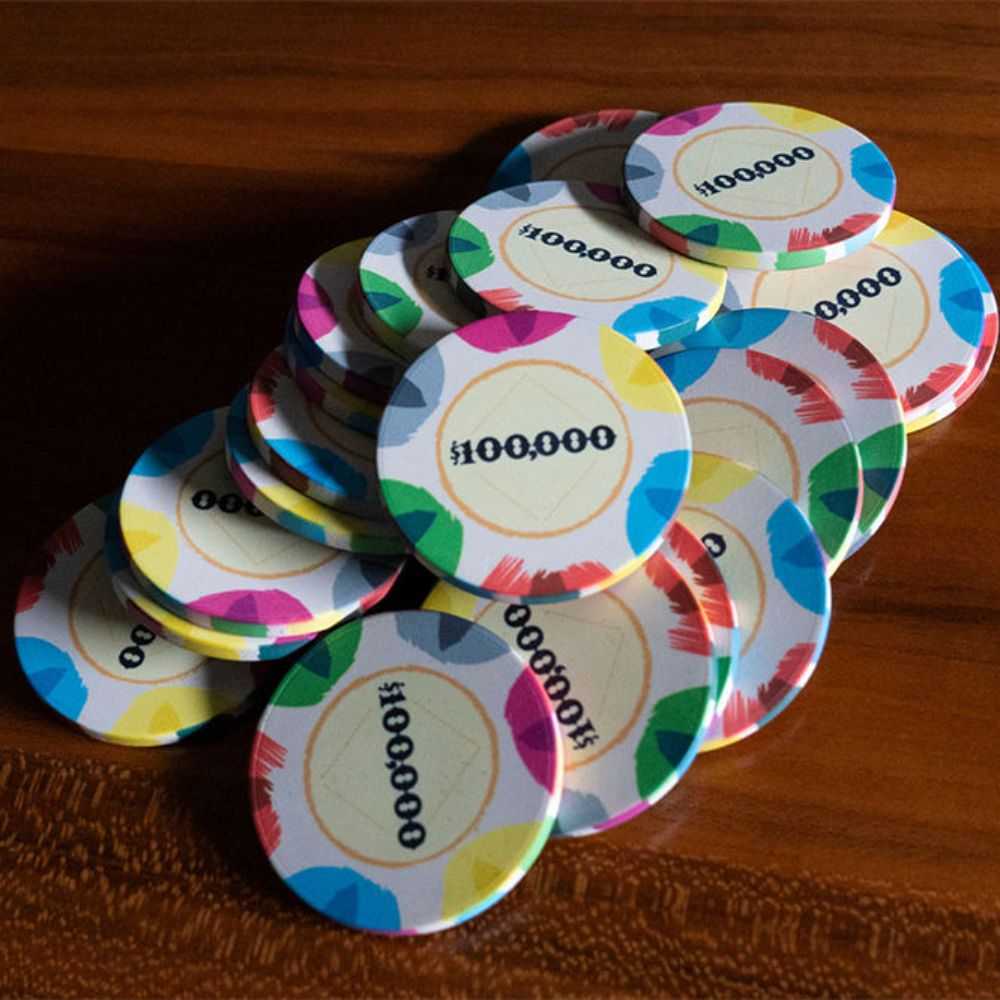 A pile of $100,000 BBO Poker Tables 500-Piece Classic Casino Poker Chips in vibrant colors is stacked together