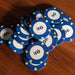 A pile of dark blue $10 BBO Poker Tables 500-Piece Classic Casino Poker Chips in a neat stack