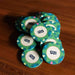 A pile of green $25 BBO Poker Tables 500-Piece Classic Casino Poker Chips stacked together