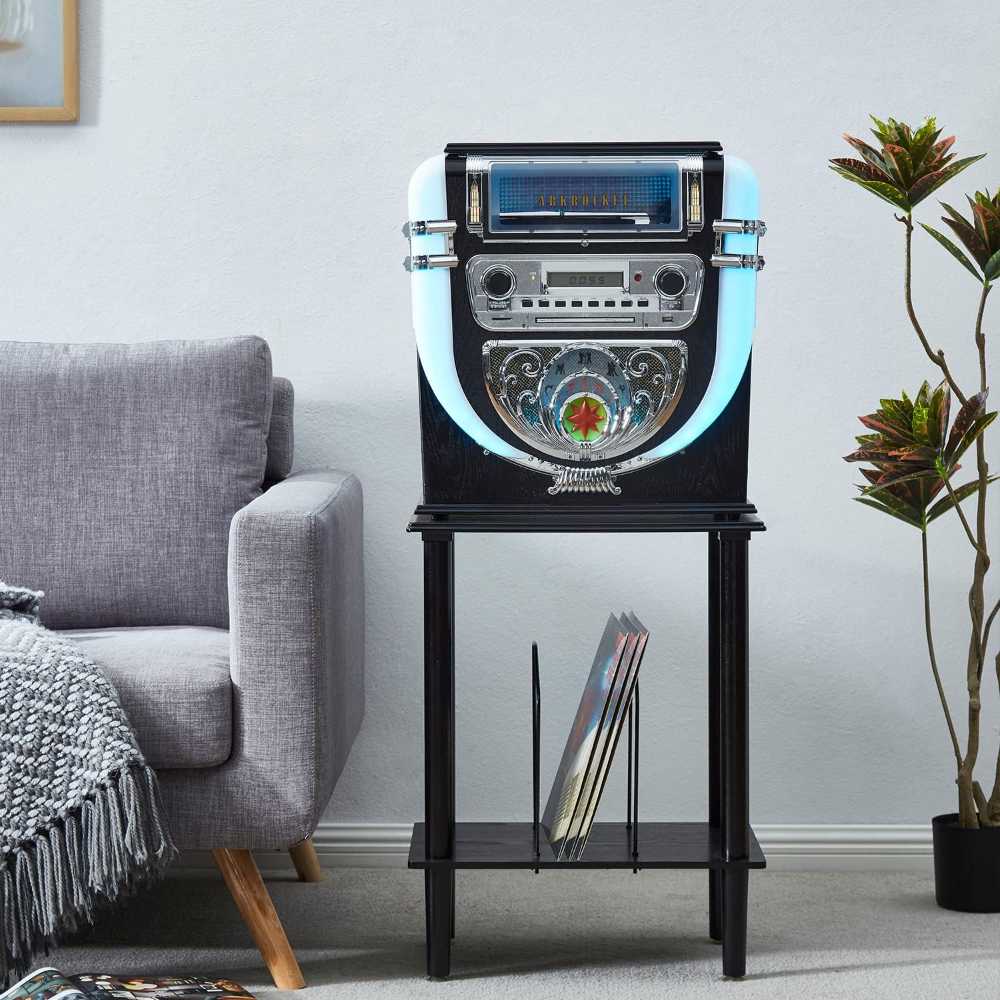 Arkrocket Boston Tabletop Jukebox Record Player Entertainment System with Stand is featured next to a gray couch