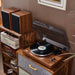 Arkrocket Cassini Bluetooth Vinyl Turntable Record Player 40 Watt Stereo Bookshelf Speakers is set up in a vintage-inspired room placed on a wooden cabinet