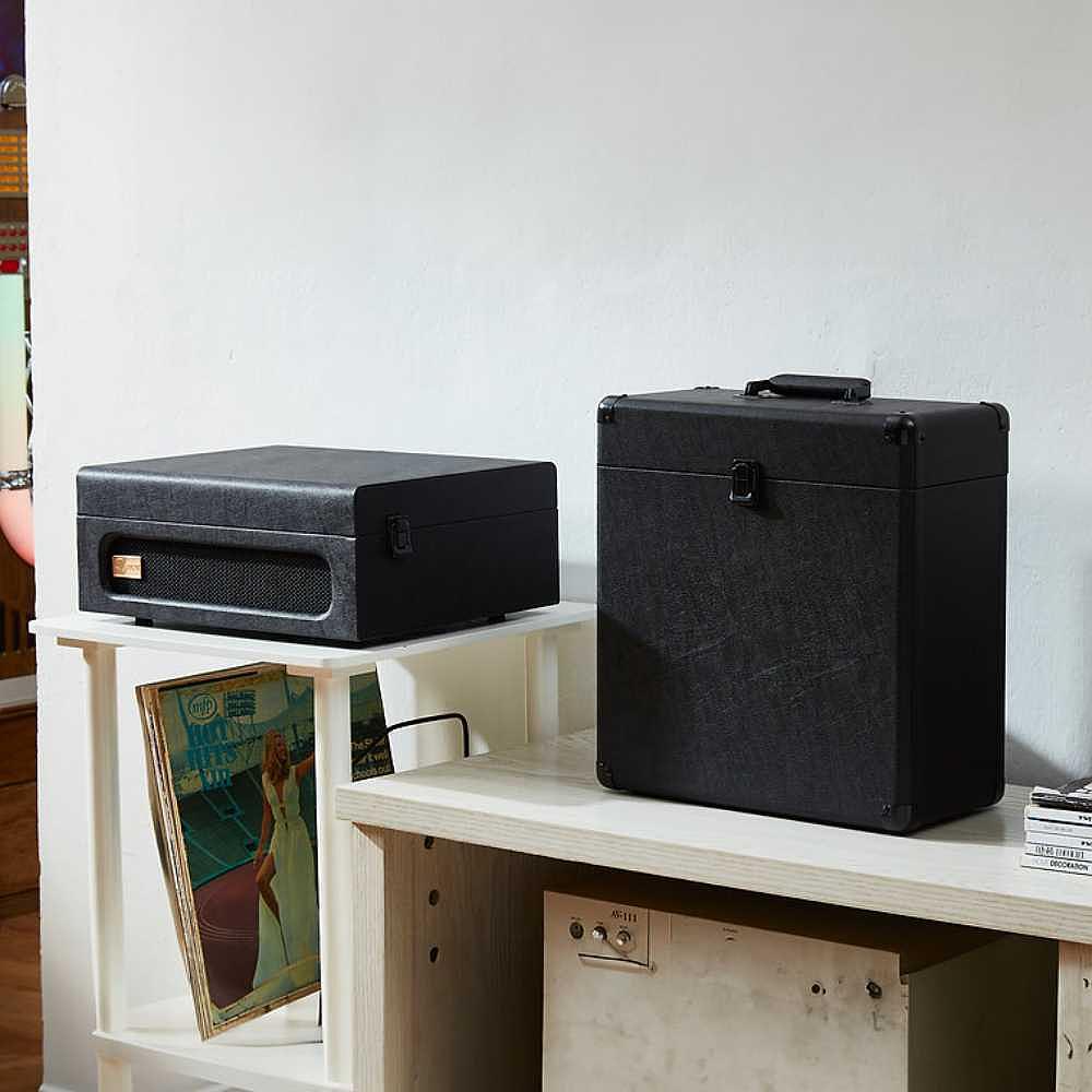 Arkrocket Coryphaeus Bluetooth Record Player with Record Storage Case (BlackGreen) is displayed on a shelf, with both the player and the storage case closed