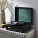 Arkrocket Coryphaeus Bluetooth Record Player with Record Storage Case (BlackGreen) is displayed on a table with a vinyl record playing and a decorative vase next to it