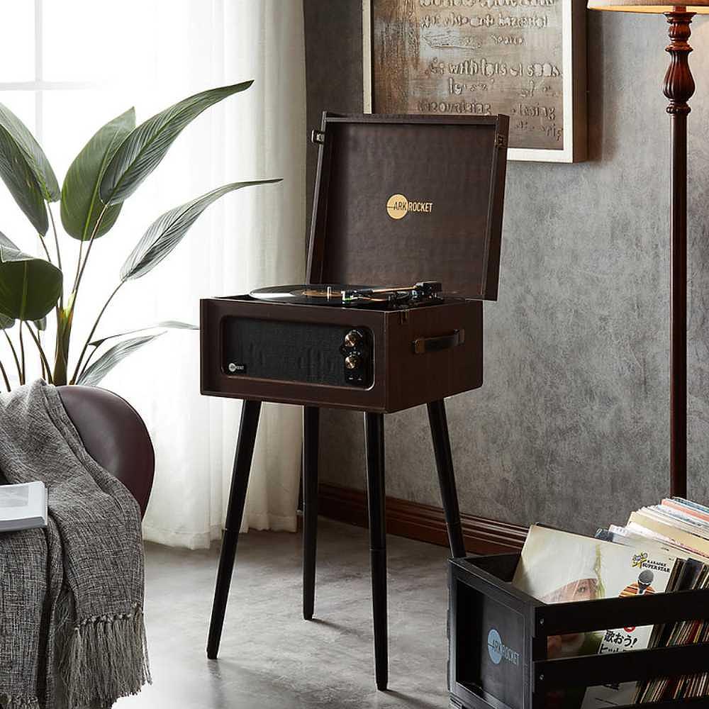 Arkrocket Discovery II Bluetooth Record Player Stand with 3-Speed Turntable (Espresso) is displayed in a stylish living room