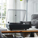 Arkrocket Huygens Bluetooth Turntable with Built-in Speakers (Black) on a table in a bright living room setting with the clear lid open