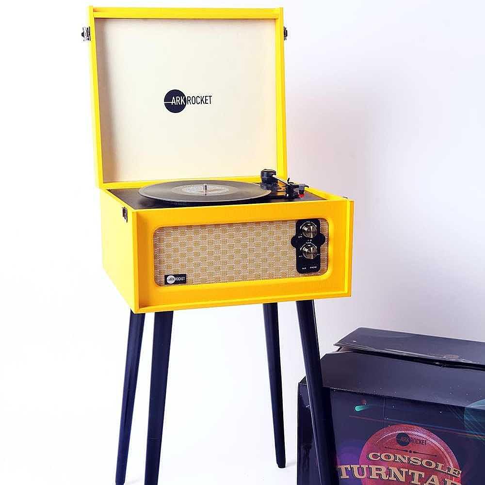 Arkrocket Retro Turntable Wireless Record Player With Legs (Yellow) is shown in a minimalist setting