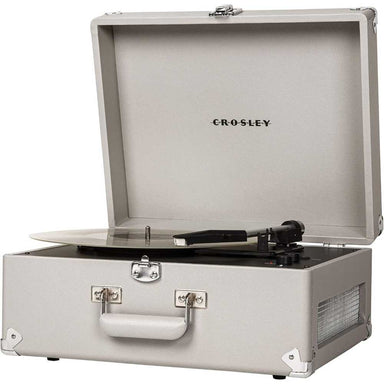 A side angle of the Crosley Anthology Portable Turntable - Gray, open with a vinyl record playing and a speaker grille visible on the side