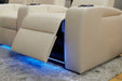 A side view of Valencia Natalie Home Theater Seating showcases the extended footrest with a glowing blue LED base